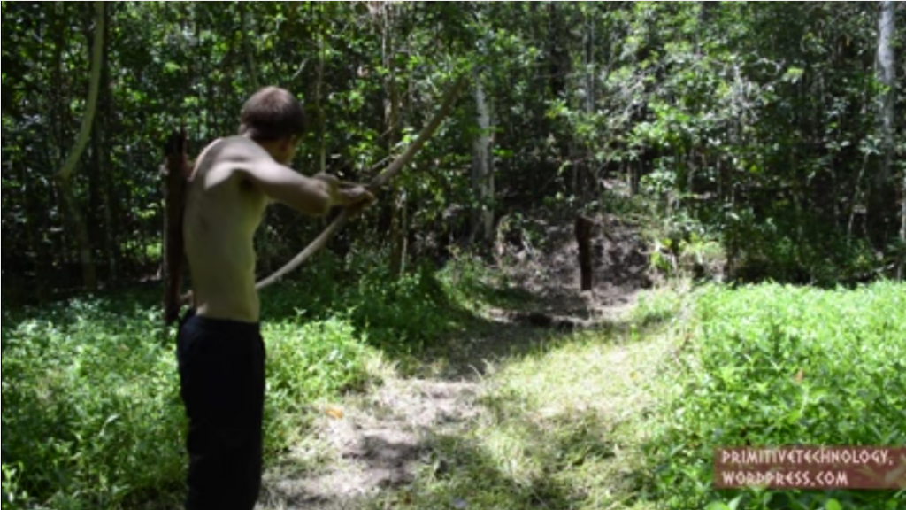 man-shoots-wooden-bow-and-arrow-from-scratch