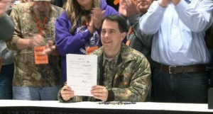 scott-walker-signs-bill-outlawing-hunter-harassment