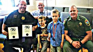 DNR-and-greenville-police-present-fallen-officers-sons-with-lifetime-hunting-and-fishing-licenses