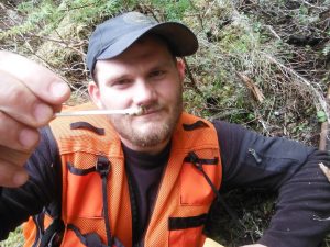 alaska-wildlife-biologist-swabs-deer-dropping-with-q-tip