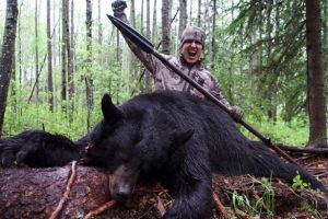 Josh-Bowmar-with-bear-he-killed-with-spear